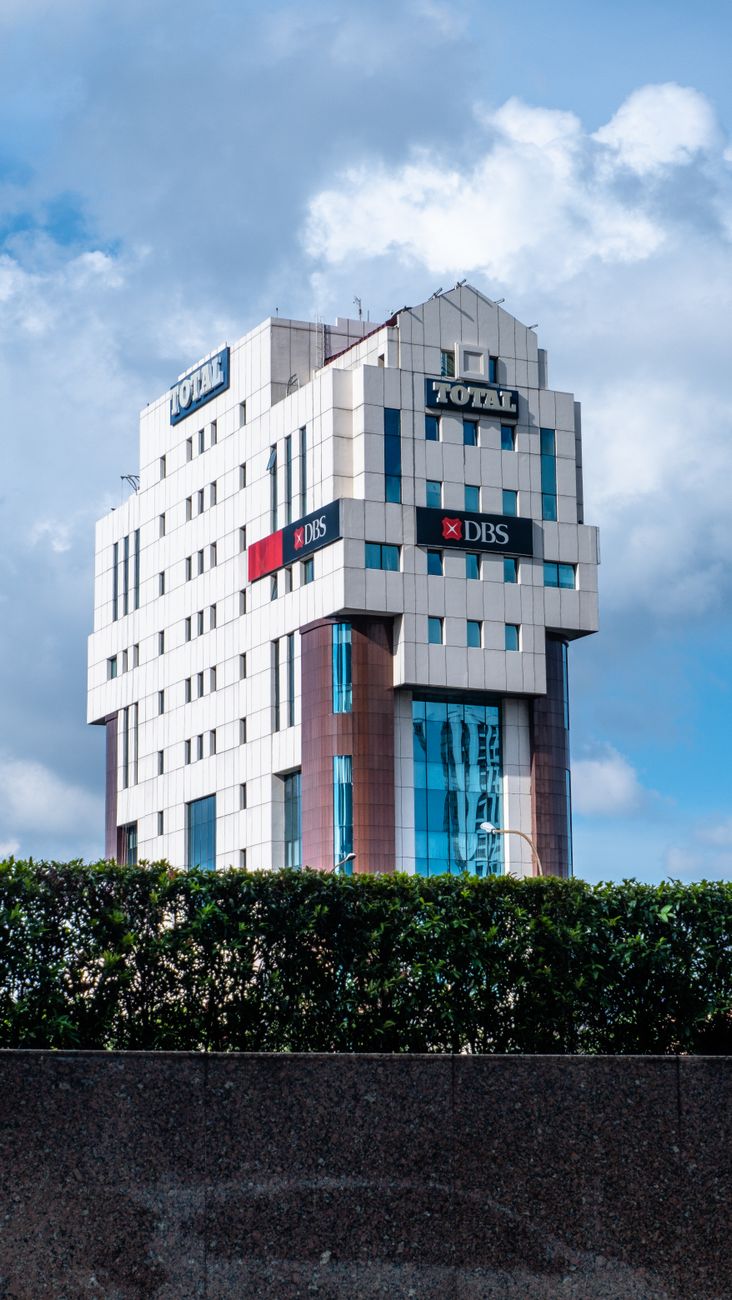 white and blue concrete building under the blue sky