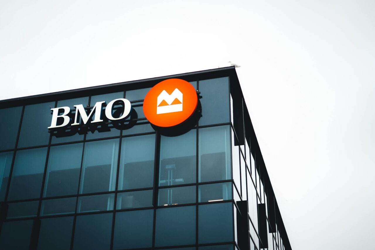 logo on top of glass building